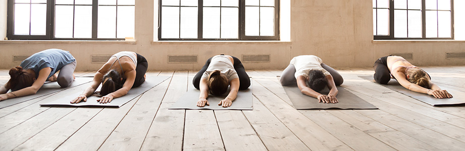 Girls doing Child Pose during yoga session